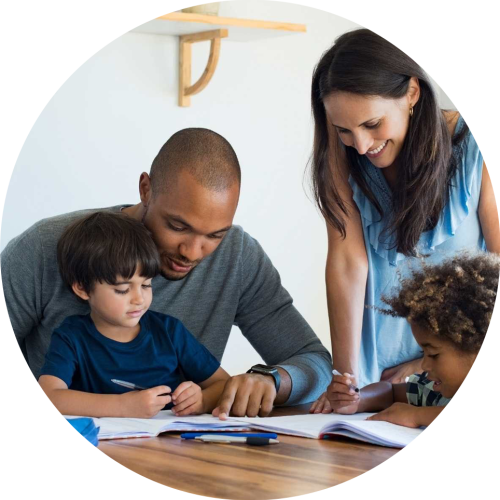 Multi ethnic family of four drawing at the table